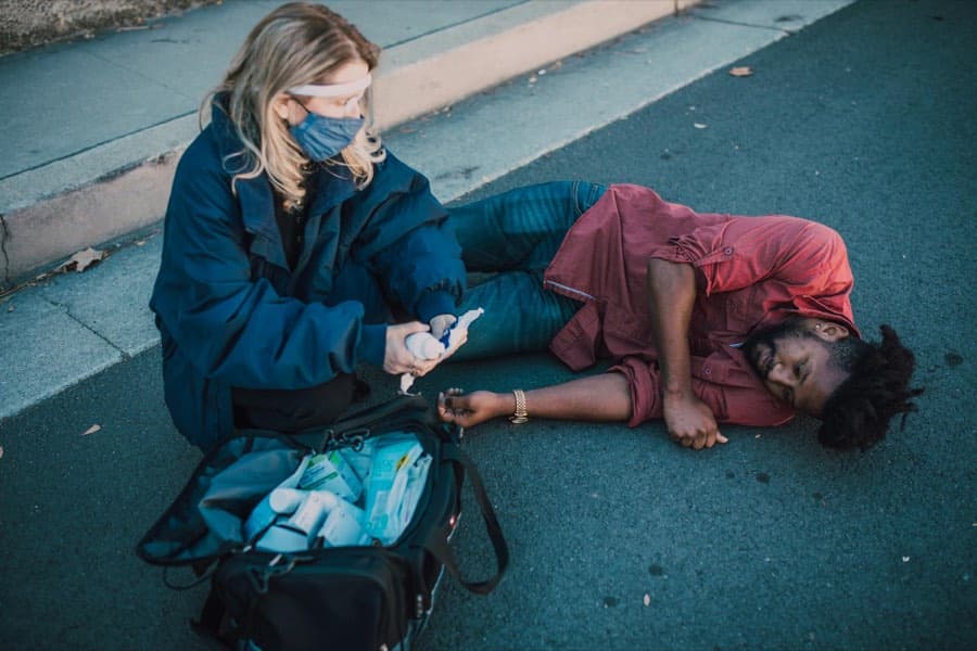 A delegate practising an emergency first aid technique during a training session
